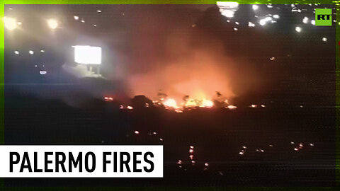 Italian firefighters battle heat-triggered flames near Palermo