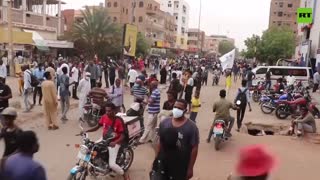 Pro-democracy protesters scuffle with police in Khartoum