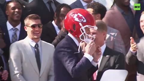 Biden puts on Chiefs helmet during team's White House visit