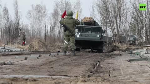 Russian troops crossover water barrier during military op