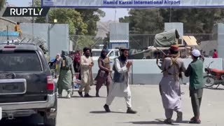 Families Storm Hamid Karzai International Airport amid Taliban soldiers shooting in the air