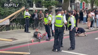 XR scuffle with police as activists block road near London’s Science Museum