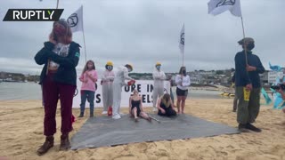 Extinction Rebellion protester pours oil on activists on St. Ives beach, Cornwall