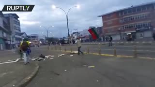 Officers shoot projectiles towards protesters in Colombia’s Cali during national strike