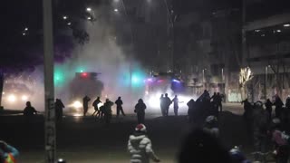 Water cannons deployed during protests demanding release of detainees in Santiago