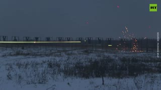 Tracers pierce the air as Russia’s mobilized troops practice night shooting