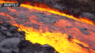 Iceland’s Fagradalsfjall volcano’s lava overflows a dam to reach a valley downhill