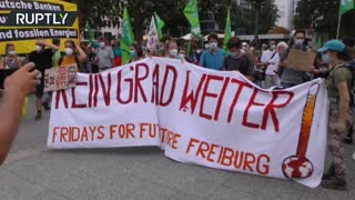 Environmental activists set ‘Deutsche Bank logo’ on fire at Frankfurt climate rally