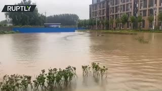 Heavy rains drench China’s Henan province, leaving Xinxiang city flooded