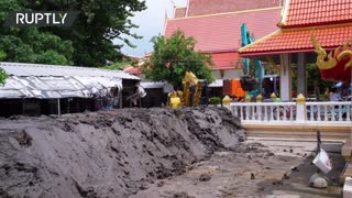 Locals build makeshift flood barriers in Thailand after monsoon rains