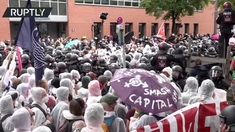 Police scuffle with eco-protesters picketing Germany’s biggest car show