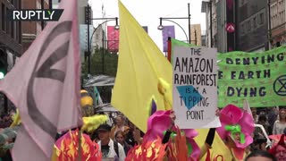 Extinction Rebellion activists march through London to wrap up two weeks of protests