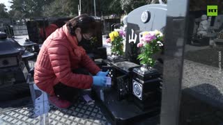 Relatives of 2011 earthquake victims gather at Fukushima cemetery