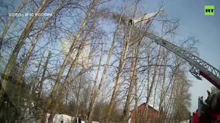 Russia's EMERCOM workers save sky-diver stuck in tree