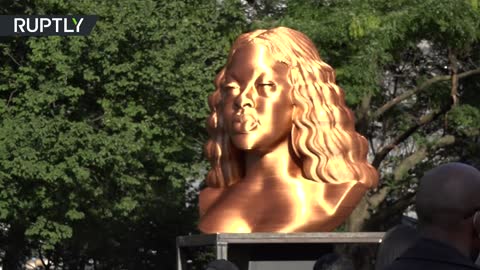 Golden statues of George Floyd, Breonna Tyler, and John Lewis go on display in NYC