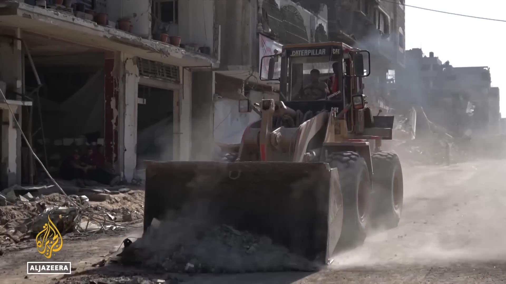 Bulldozers clear rubble in Gaza City as Palestinians return to rebuild homes and lives