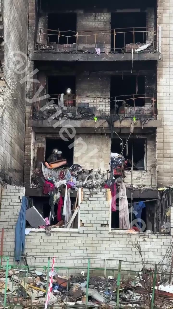 The damaged house in Vyshhorod now. Volunteers, despite air raid sirens, are shoveling