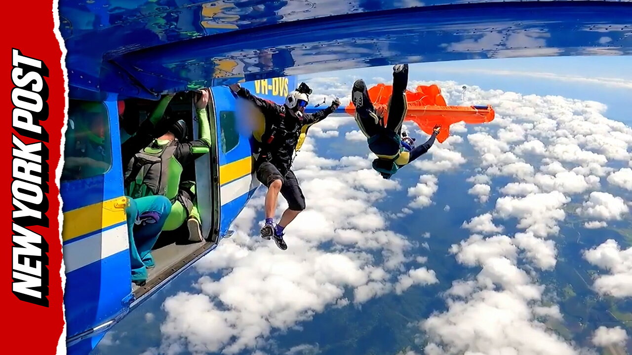 Heart-stopping moment skydivers parachute gets hooked on planes tail -- leaving him dangling 15,000 feet in the air