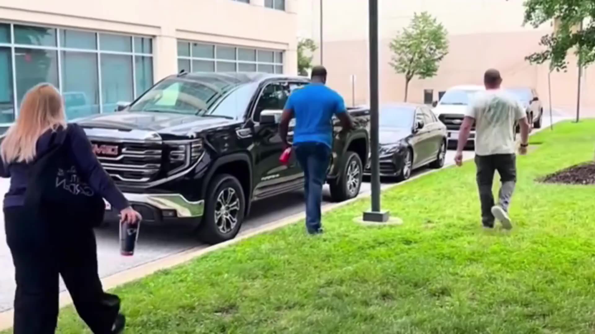 Federal agents detain a female outside of a courthouse. An agent tells a Corpulent Karen