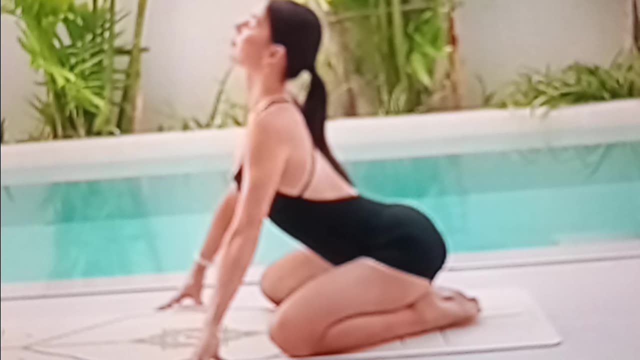 Soothing yoga flow by the pool
