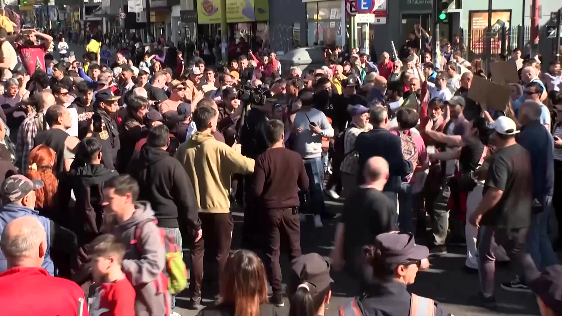 Argentina’s Milei rushed away from rally as protesters throw rocks