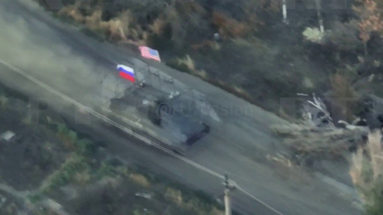 Russian Fighters Ride on Captured American Armored Personnel Carrier