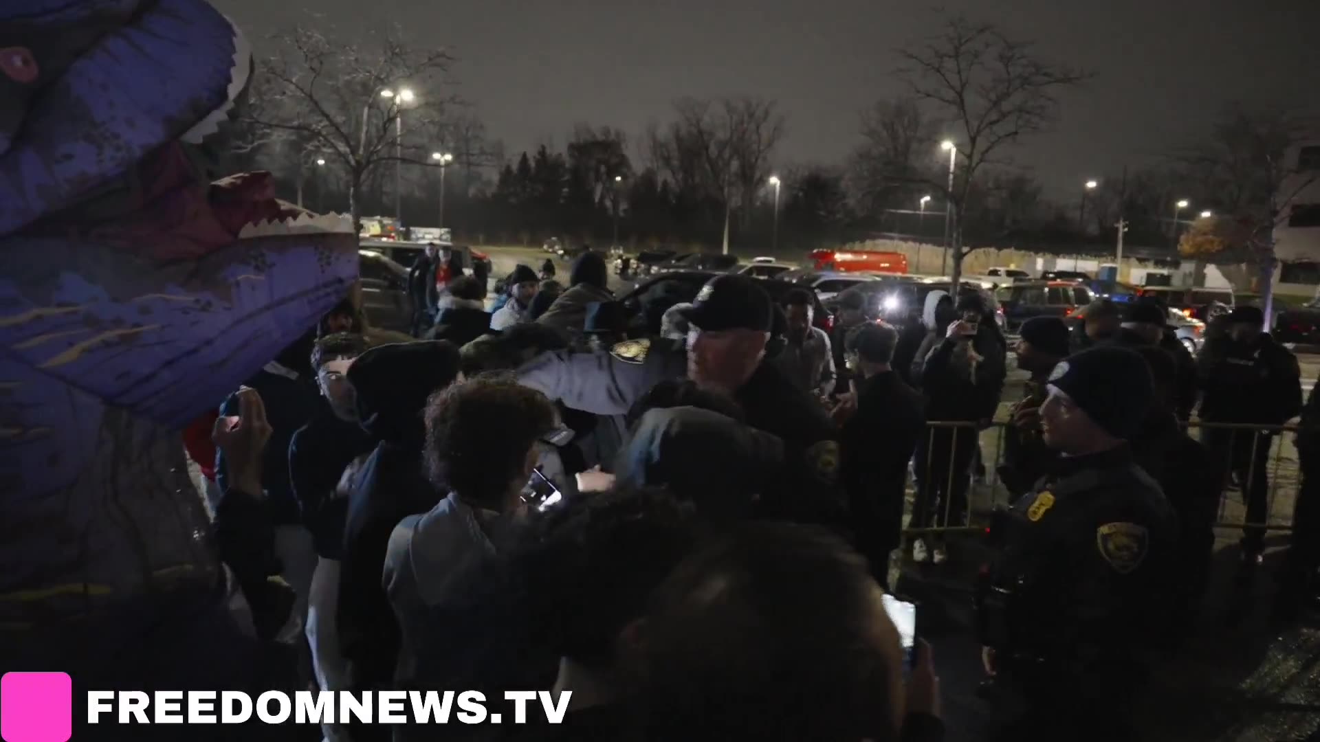 Protester appears detained as Dearborn Michigan police encircle Americans Against