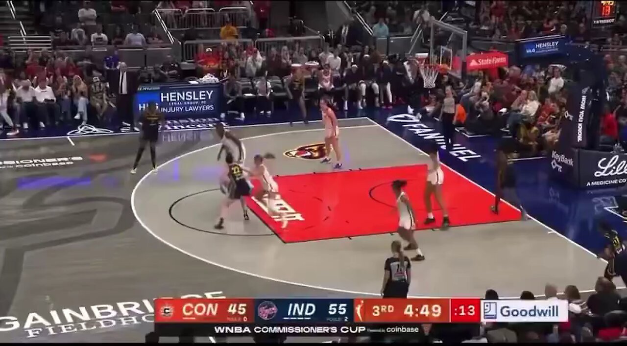 Indiana Fevers Caitlin Clark takes a hard foul from Marina Mabrey of the Connecticut Sun