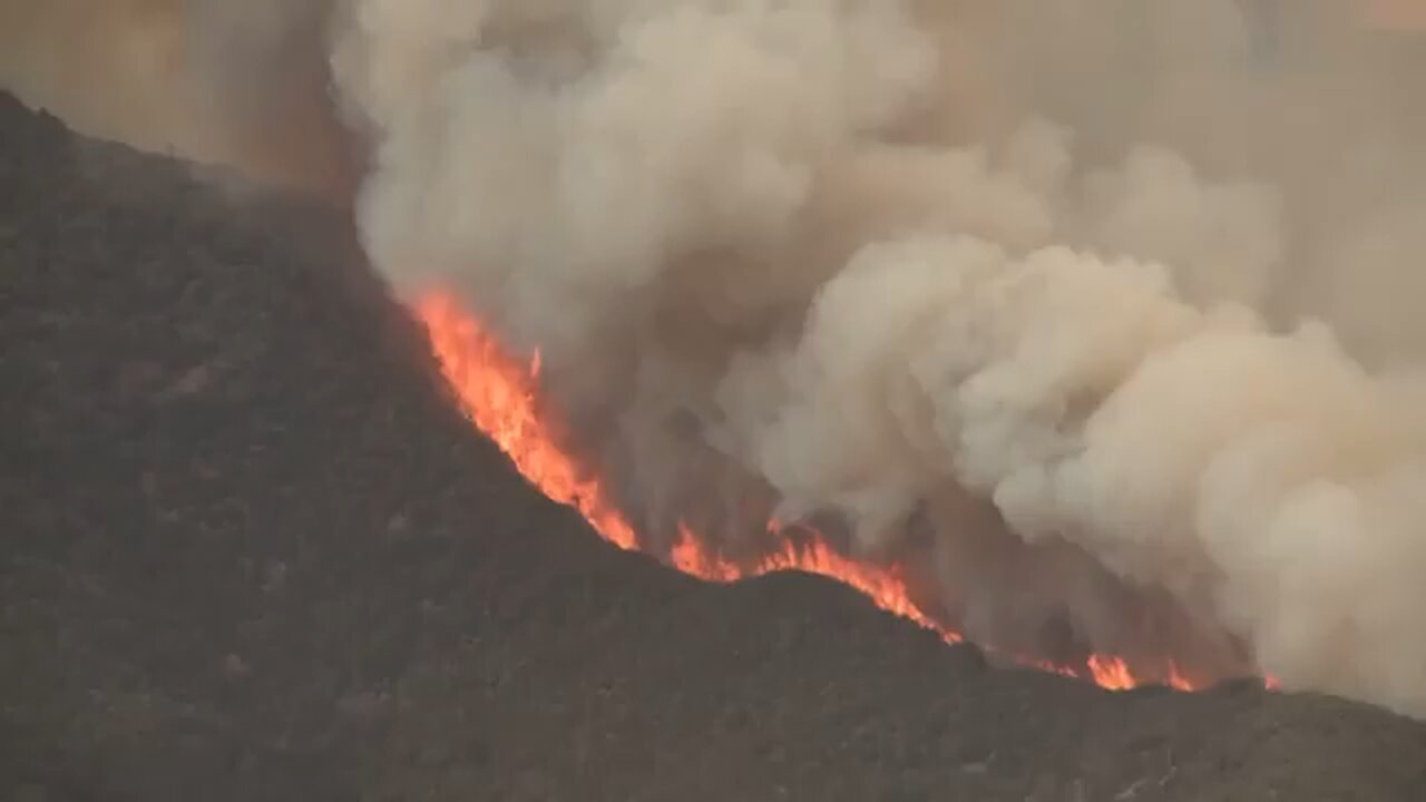 Massive wildfire in Central California threatens homes, injures 3 people