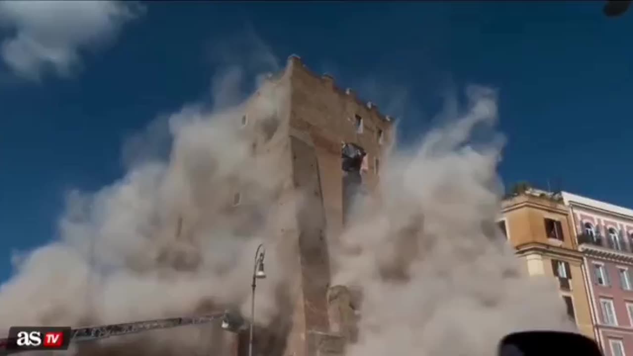 A worker was killed and several others were injured when part of a historic tower in central Rome