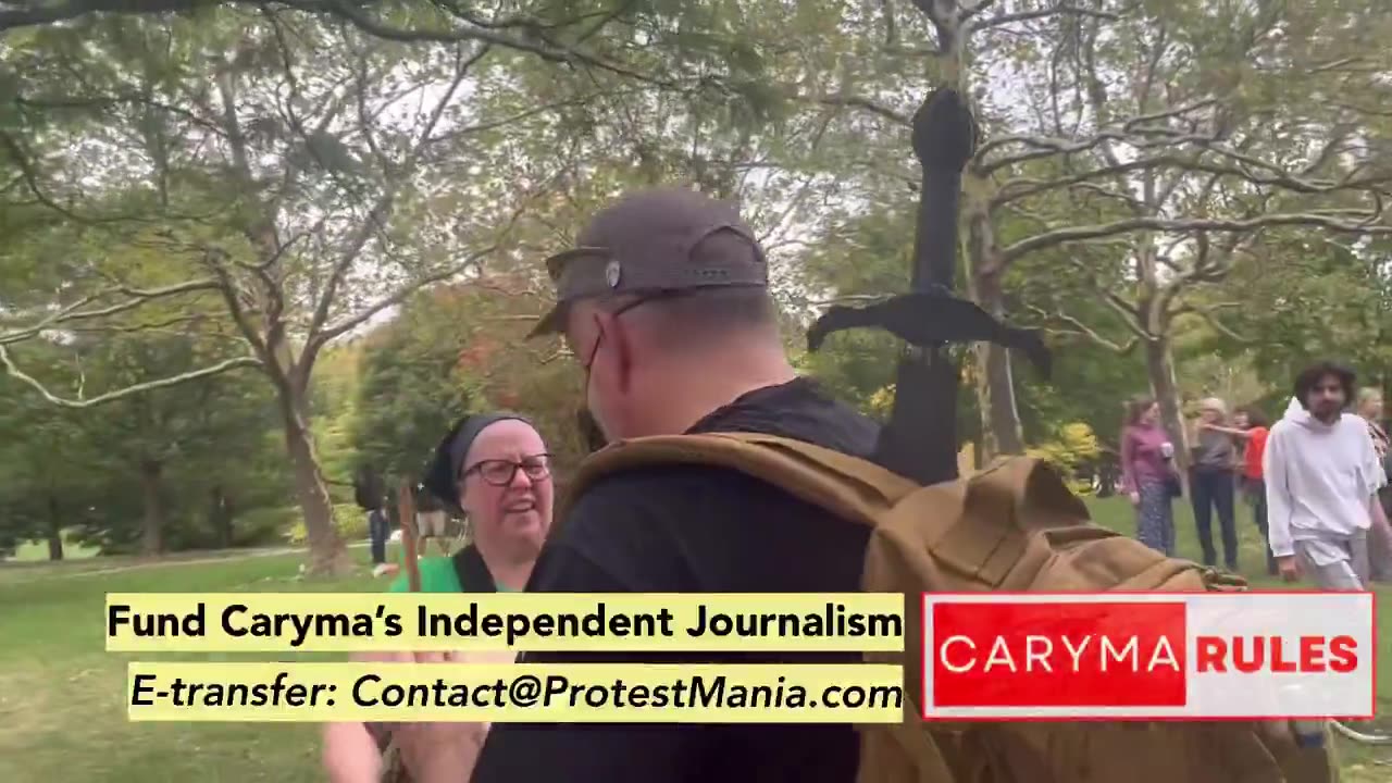 A UNHINGED antifa Karen bangs her drum to drown out a dude signing All You Need Is Love in a park
