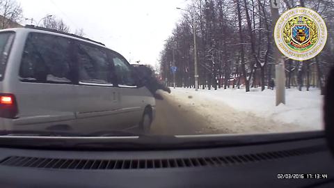 Police officer shields child while being struck by car