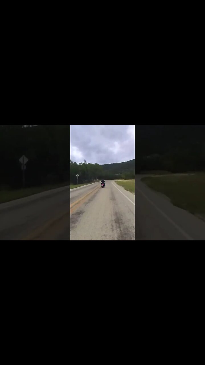 Harley Davidson Road King passing me in the Texas Hill Country