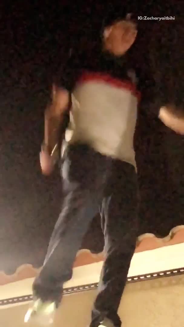 Guy jumps off ledge onto trampoline and back onto ledge, makes a mistake and lands on head