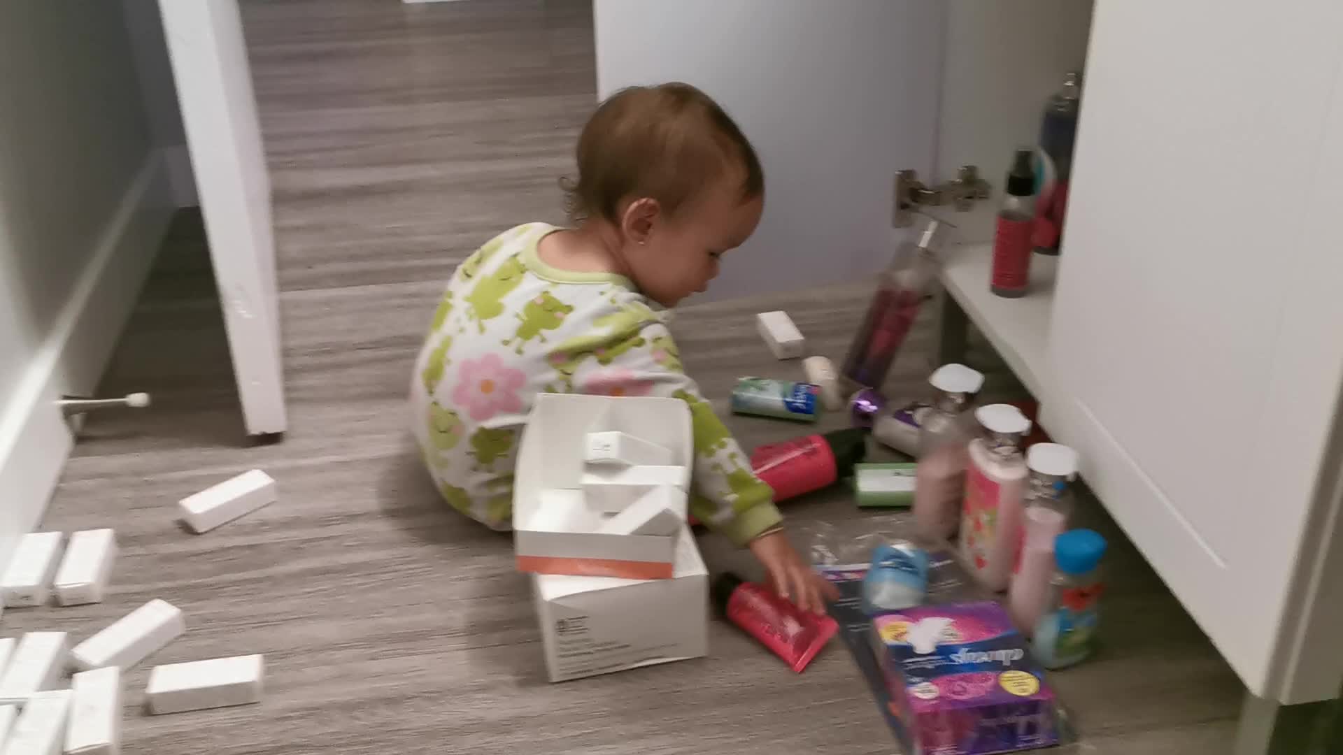 Baby is exploring Mommys stuff