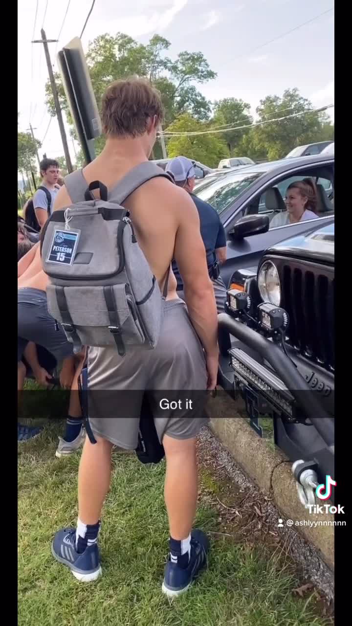 Football Team Helps Lift Girls Car Back over Curb
