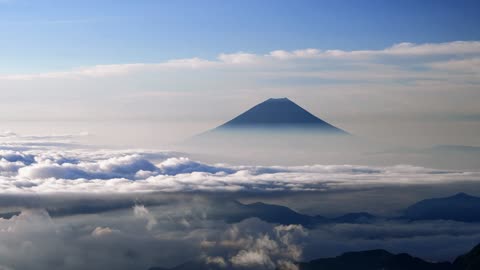 "Mystical Morning: Mount Fuji Embraced by Clouds"