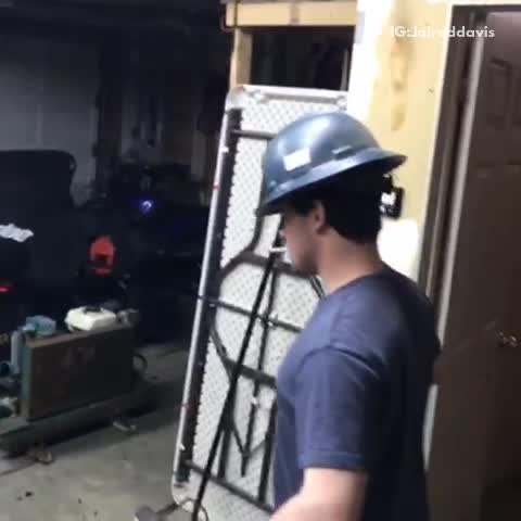 Two guys have a stand off with beer bottles in a garage, the good the bad and the ugly song
