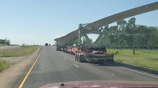 Huge Wind tower blade down highway